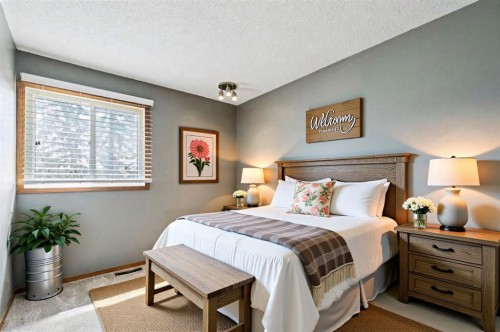 145 Alpine Crescent Se, Airdrie, AB - Indoor Photo Showing Bedroom