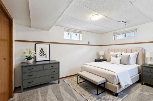 145 Alpine Crescent Se, Airdrie, AB - Indoor Photo Showing Bedroom