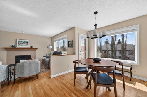 213 Citadel Gardens Nw, Calgary, AB - Indoor Photo Showing Dining Room With Fireplace