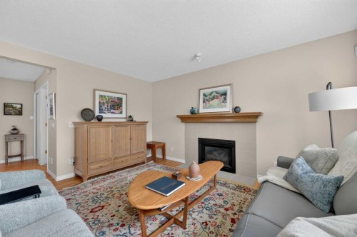 213 Citadel Gardens Nw, Calgary, AB - Indoor Photo Showing Living Room With Fireplace