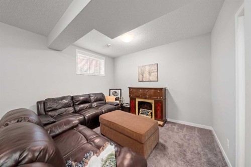 39 Heritage Boulevard, Cochrane, AB - Indoor With Fireplace