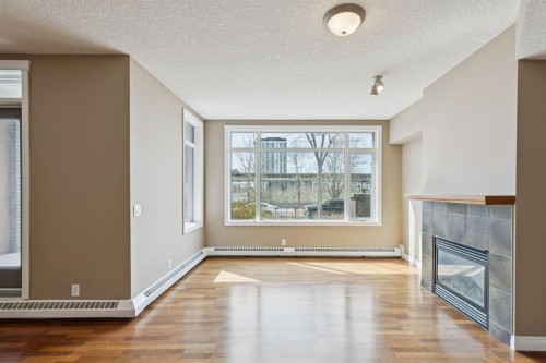 108-990 Centre Avenue Ne, Calgary, AB - Indoor With Fireplace