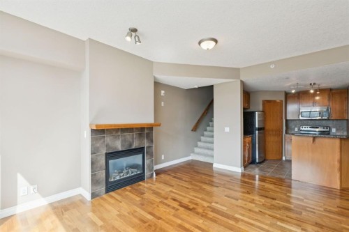108-990 Centre Avenue Ne, Calgary, AB - Indoor Photo Showing Other Room With Fireplace