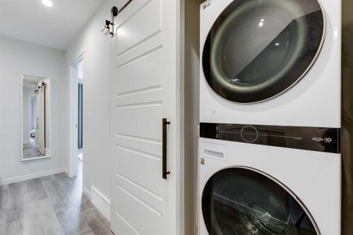 302-260 Rowley Way Nw, Calgary, AB - Indoor Photo Showing Laundry Room