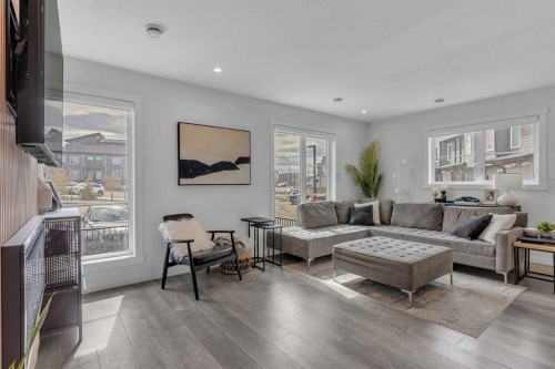 302-260 Rowley Way Nw, Calgary, AB - Indoor Photo Showing Living Room