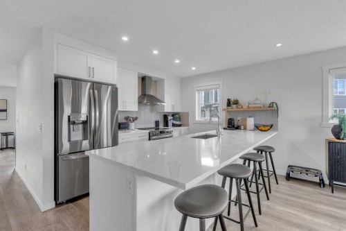 302-260 Rowley Way Nw, Calgary, AB - Indoor Photo Showing Kitchen With Stainless Steel Kitchen With Upgraded Kitchen