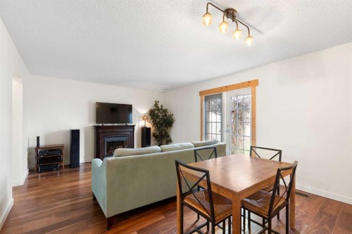 84 Abingdon Crescent Ne, Calgary, AB - Indoor With Fireplace