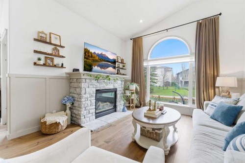 212 Cove Drive, Chestermere, AB - Indoor Photo Showing Living Room With Fireplace