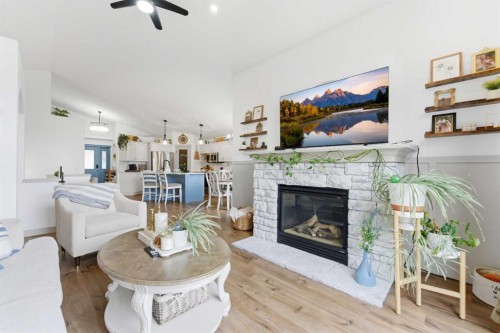 212 Cove Drive, Chestermere, AB - Indoor Photo Showing Living Room With Fireplace