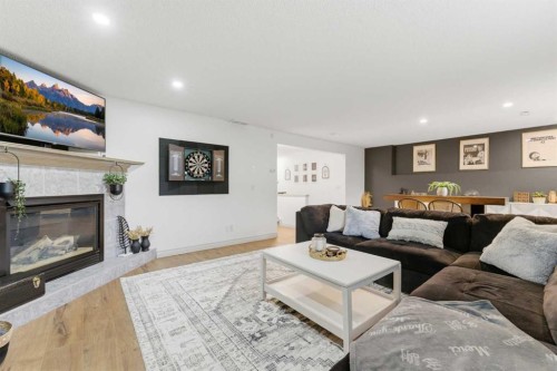212 Cove Drive, Chestermere, AB - Indoor Photo Showing Living Room With Fireplace