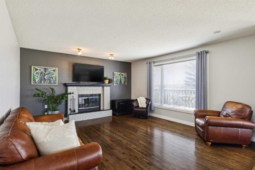 98 Sierra Nevada Green Sw, Calgary, AB - Indoor Photo Showing Living Room With Fireplace