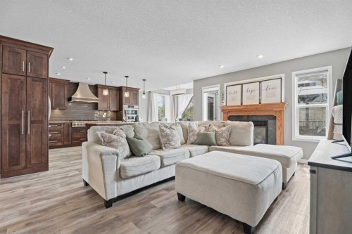 31 Brightondale Close Se, Calgary, AB - Indoor Photo Showing Living Room With Fireplace