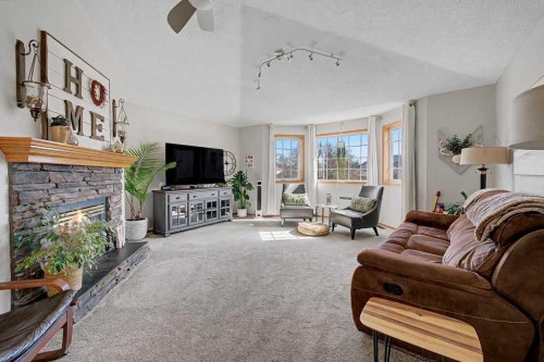 450 Douglas Glen Boulevard Se, Calgary, AB - Indoor Photo Showing Living Room With Fireplace