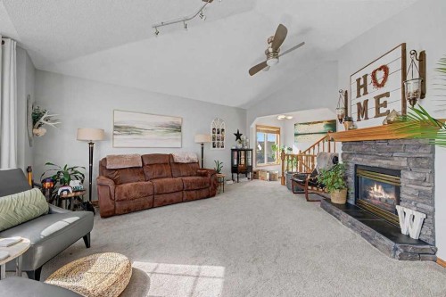 450 Douglas Glen Boulevard Se, Calgary, AB - Indoor Photo Showing Living Room With Fireplace