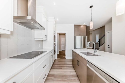55 Silver Spruce Grove Sw, Calgary, AB - Indoor Photo Showing Kitchen With Double Sink With Upgraded Kitchen