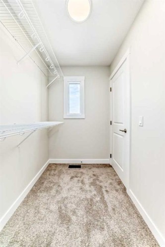55 Silver Spruce Grove Sw, Calgary, AB - Indoor Photo Showing Other Room
