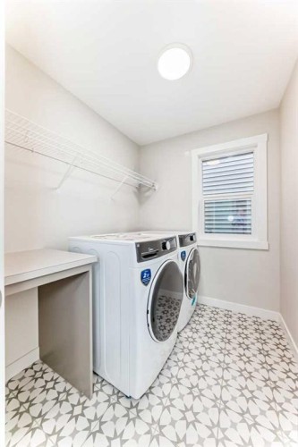 55 Silver Spruce Grove Sw, Calgary, AB - Indoor Photo Showing Laundry Room