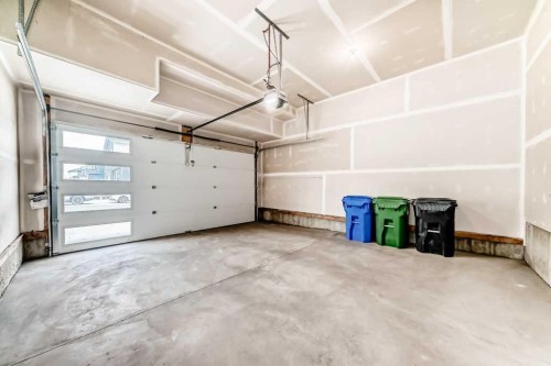 55 Silver Spruce Grove Sw, Calgary, AB - Indoor Photo Showing Garage