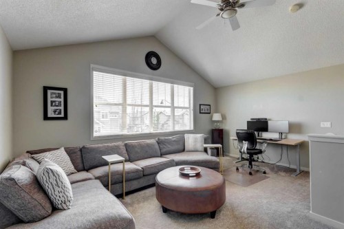 143 Cougarstone Court Sw, Calgary, AB - Indoor Photo Showing Living Room