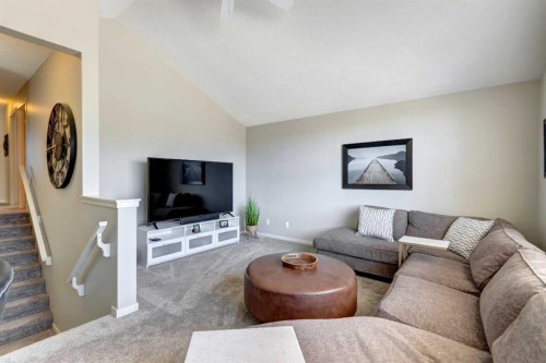 143 Cougarstone Court Sw, Calgary, AB - Indoor Photo Showing Living Room