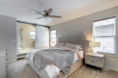 143 Cougarstone Court Sw, Calgary, AB - Indoor Photo Showing Bedroom