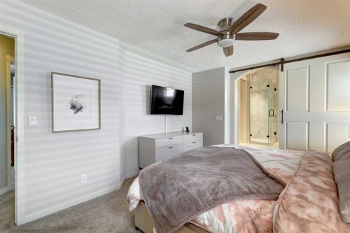 143 Cougarstone Court Sw, Calgary, AB - Indoor Photo Showing Bedroom