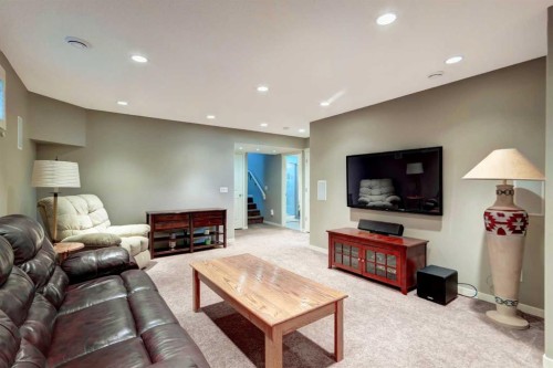 143 Cougarstone Court Sw, Calgary, AB - Indoor Photo Showing Living Room