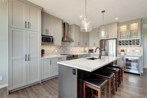 143 Cougarstone Court Sw, Calgary, AB - Indoor Photo Showing Kitchen With Upgraded Kitchen
