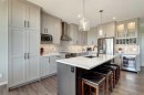143 Cougarstone Court Sw, Calgary, AB  - Indoor Photo Showing Kitchen With Upgraded Kitchen 