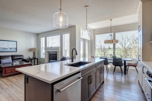 143 Cougarstone Court Sw, Calgary, AB - Indoor Photo Showing Kitchen With Double Sink With Upgraded Kitchen