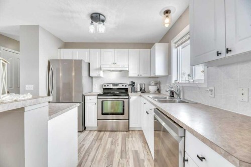 1905 Strathcona Terrace, Strathmore, AB - Indoor Photo Showing Kitchen With Stainless Steel Kitchen With Double Sink