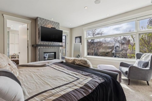 1624 Broadview Road Nw, Calgary, AB - Indoor Photo Showing Bedroom With Fireplace