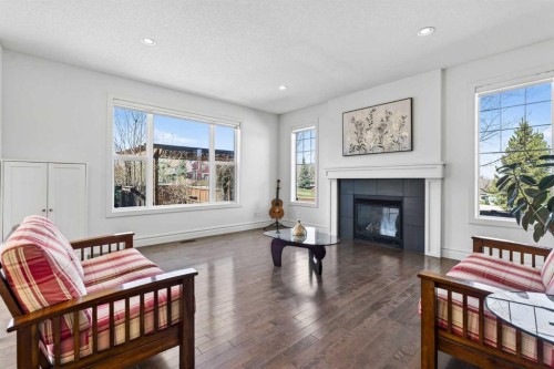 421 Auburn Bay Boulevard Se, Calgary, AB - Indoor Photo Showing Living Room With Fireplace