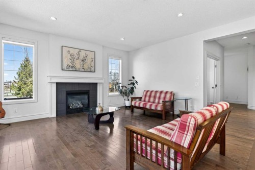 421 Auburn Bay Boulevard Se, Calgary, AB - Indoor Photo Showing Living Room With Fireplace