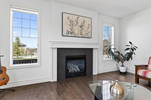 421 Auburn Bay Boulevard Se, Calgary, AB - Indoor Photo Showing Living Room With Fireplace