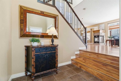 78 Westmount Circle, Okotoks, AB - Indoor Photo Showing Other Room With Fireplace
