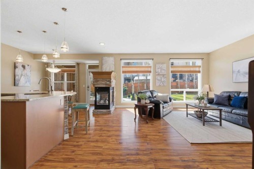 78 Westmount Circle, Okotoks, AB - Indoor Photo Showing Other Room With Fireplace