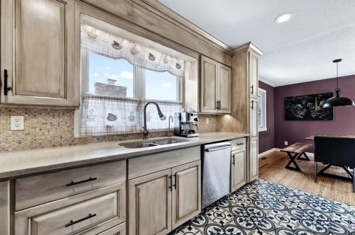 8 Slocan Road Sw, Calgary, AB - Indoor Photo Showing Kitchen With Double Sink