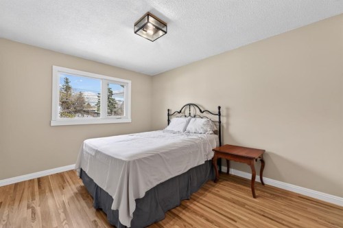 8 Slocan Road Sw, Calgary, AB - Indoor Photo Showing Bedroom