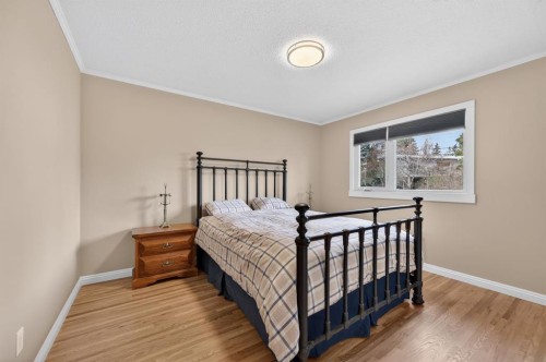 8 Slocan Road Sw, Calgary, AB - Indoor Photo Showing Bedroom