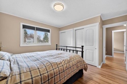 8 Slocan Road Sw, Calgary, AB - Indoor Photo Showing Bedroom