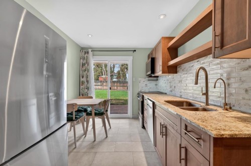 8 Slocan Road Sw, Calgary, AB - Indoor Photo Showing Kitchen With Double Sink With Upgraded Kitchen