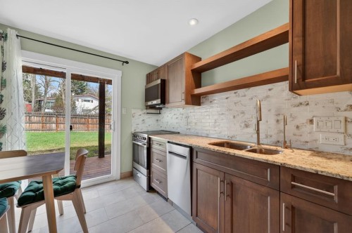 8 Slocan Road Sw, Calgary, AB - Indoor Photo Showing Kitchen With Double Sink