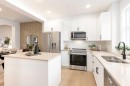 107 Osprey Hill Point Sw, Calgary, AB  - Indoor Photo Showing Kitchen With Double Sink With Upgraded Kitchen 