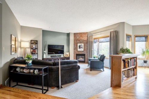 120 Bow Meadows Drive, Cochrane, AB - Indoor Photo Showing Living Room With Fireplace