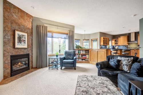 120 Bow Meadows Drive, Cochrane, AB - Indoor Photo Showing Living Room With Fireplace