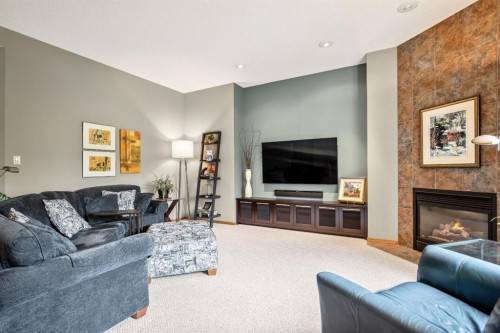 120 Bow Meadows Drive, Cochrane, AB - Indoor Photo Showing Living Room With Fireplace