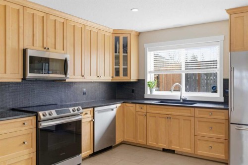 131 25 Avenue Ne, Calgary, AB - Indoor Photo Showing Kitchen With Stainless Steel Kitchen With Double Sink