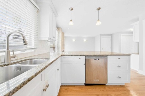 1728 Lake Bonavista Drive Se, Calgary, AB - Indoor Photo Showing Kitchen With Double Sink