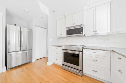1728 Lake Bonavista Drive Se, Calgary, AB - Indoor Photo Showing Kitchen